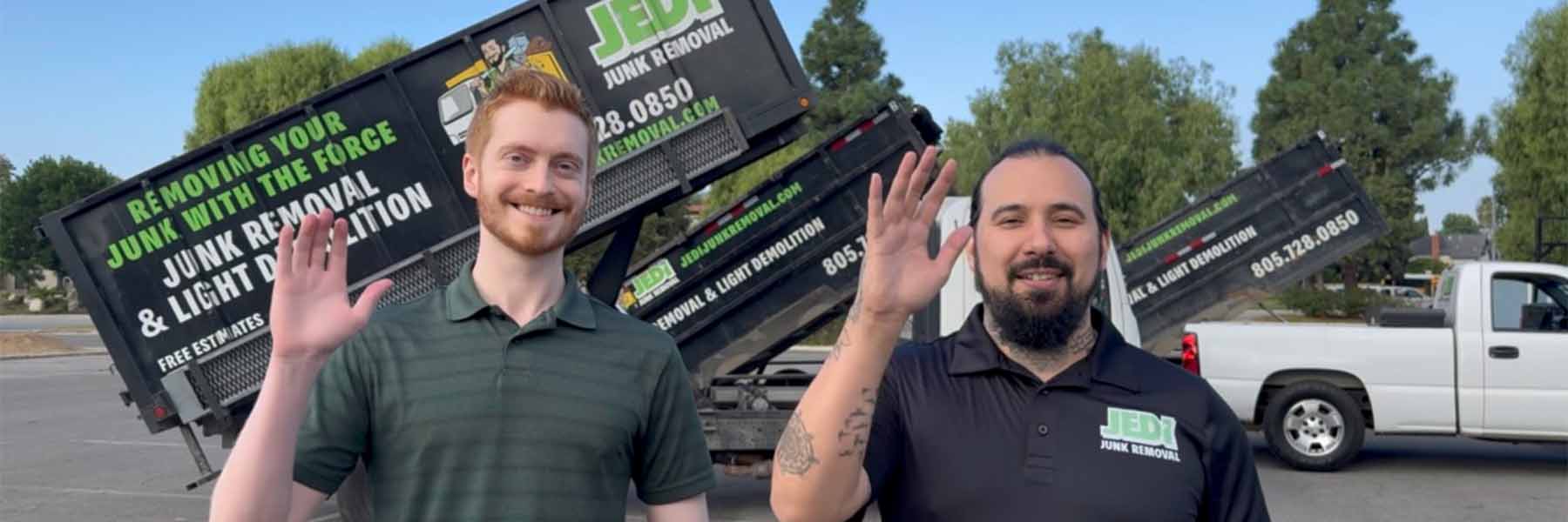 Ryan Springer waving beside a row of Jedi Junk Removal trucks
