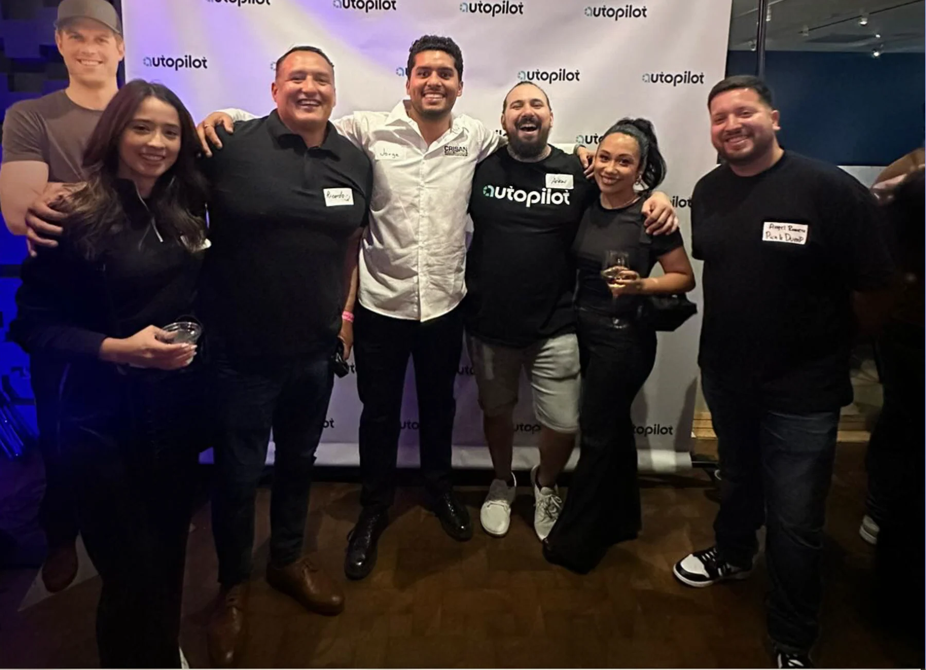 Andrew Thompson celebrating with members of the Autopilot home service community