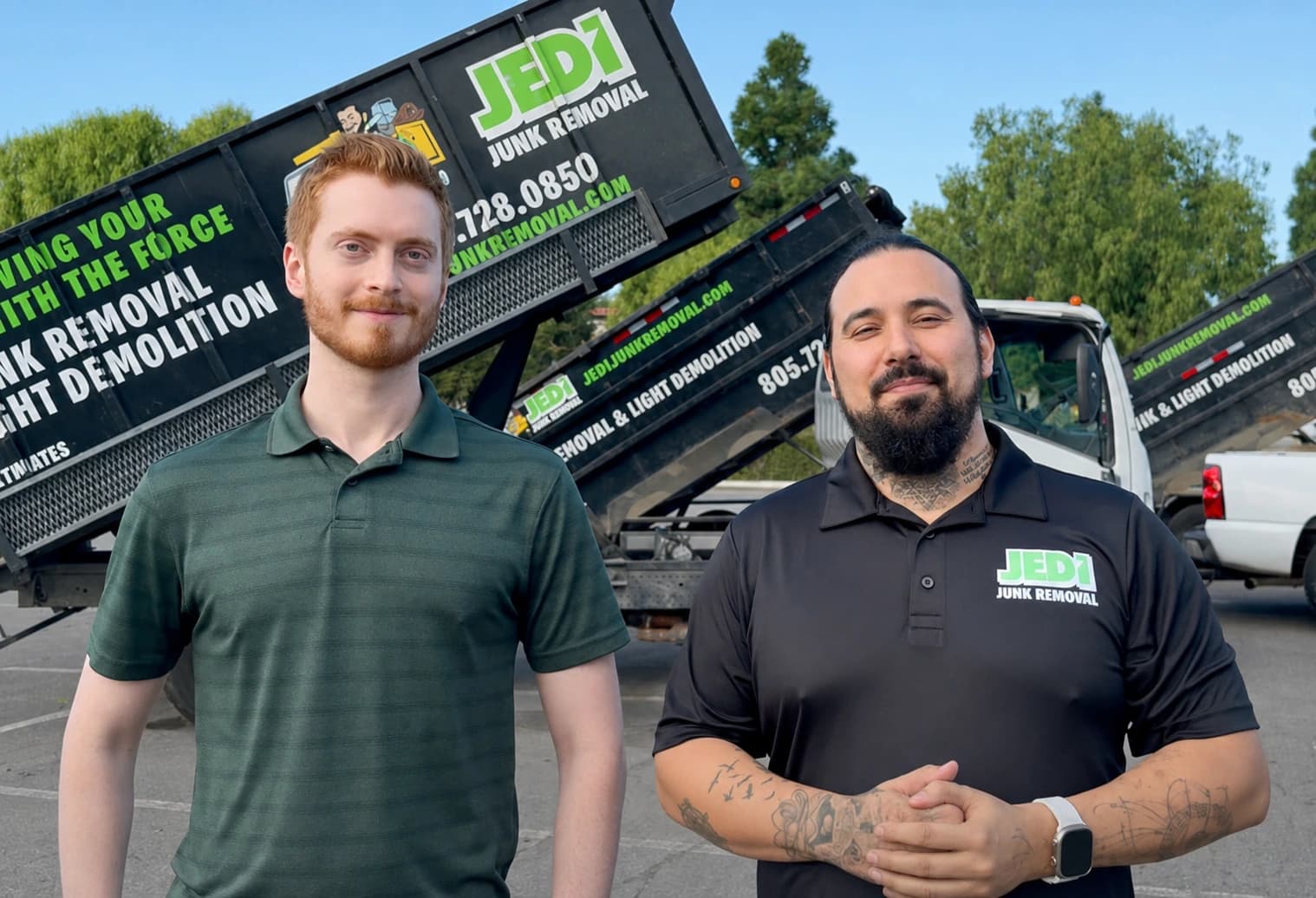 Autopilot founder Andrew Thompson standing in front of his junk removal trucks