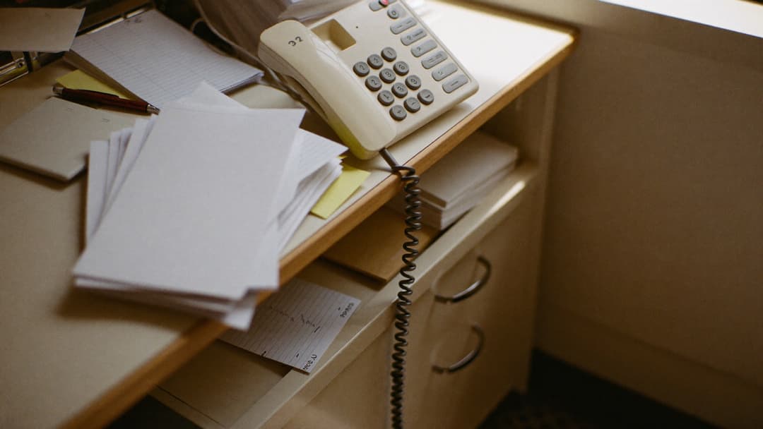 Home service owner reviewing a marketing dashboard showing calls and revenue by channel
