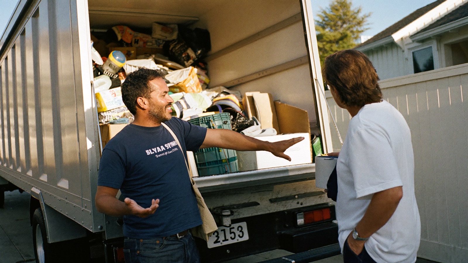 Walkthrough estimate of an apartment with furniture staged for junk removal