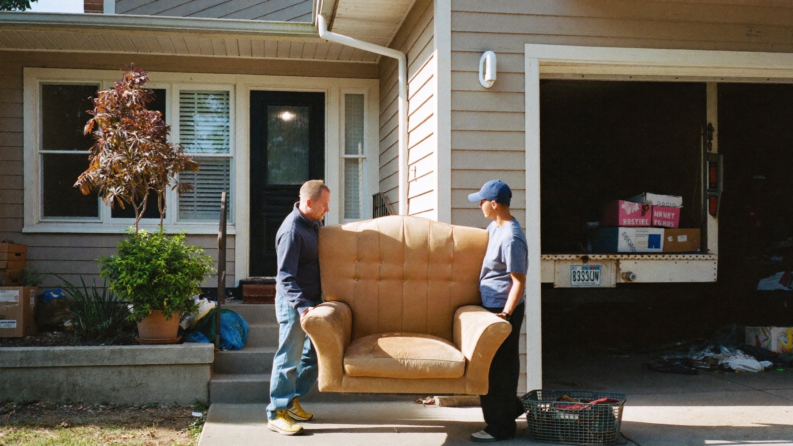 Junk removal crew photo being selected as a Facebook ad creative on a laptop